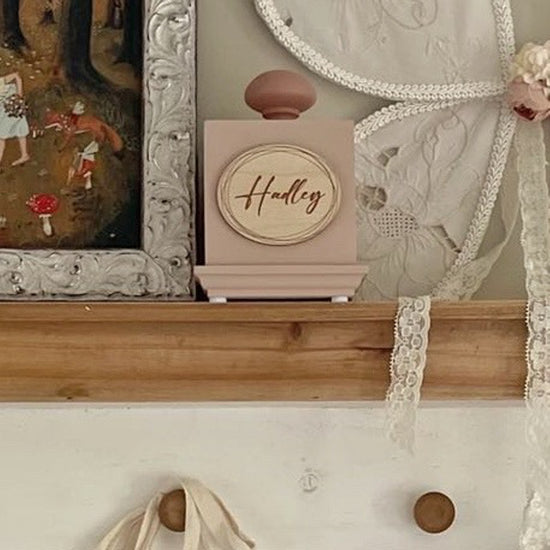 custom engraved music box in pink is so sweet on a shelf in baby's nursery